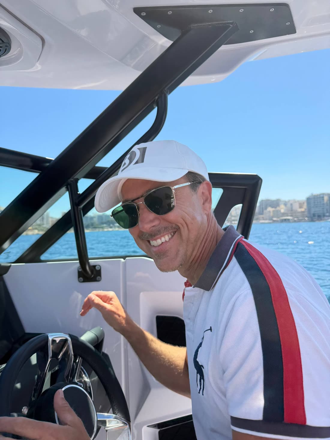 At the helm of the Axopar 29 off the Maltese coast